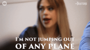GIF: scared woman says "I'm not jumping out of any plane"