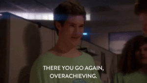GIF: a man says "there you go again, overachieving"