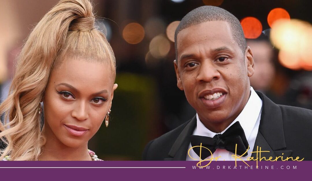 “Why is it so hard to change?”​ – explained. - Photo of Beyonce and Jay-Z. A purple footer can be seen with the Dr. Katherine signature in yellow and www.drkatherine.com underneath that
