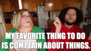 GIF: Couple talking, caption reads: "My favourite thing to do is complain about things"