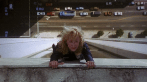 GIF: Meryl Streep looks like she's hanging off a ledge and then lifts her arms so you can see that she is lying down and the 'building' is horizontal
