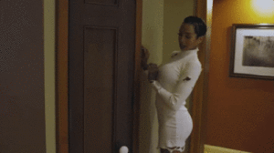 GIF: scared woman opening her closet