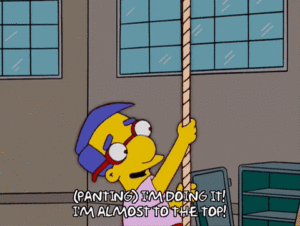 GIF: The Simpsons Character climbs a rope saying: (panting) "I'm doing it! I'm almost to the top!"